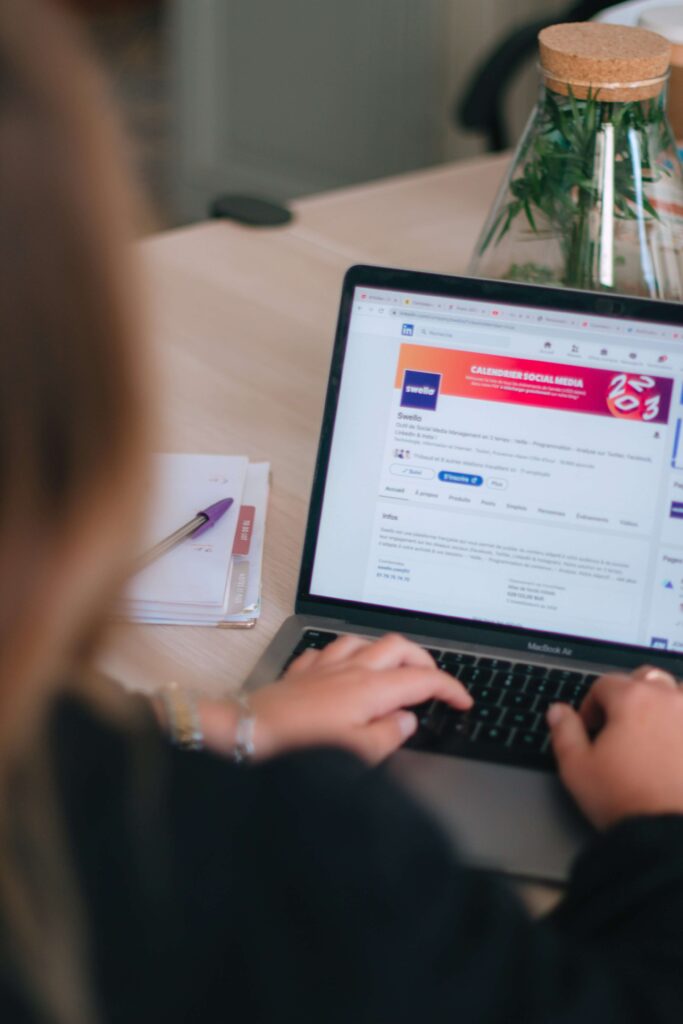 SEO specialist performing a local SEO audit process on a business website using a laptop